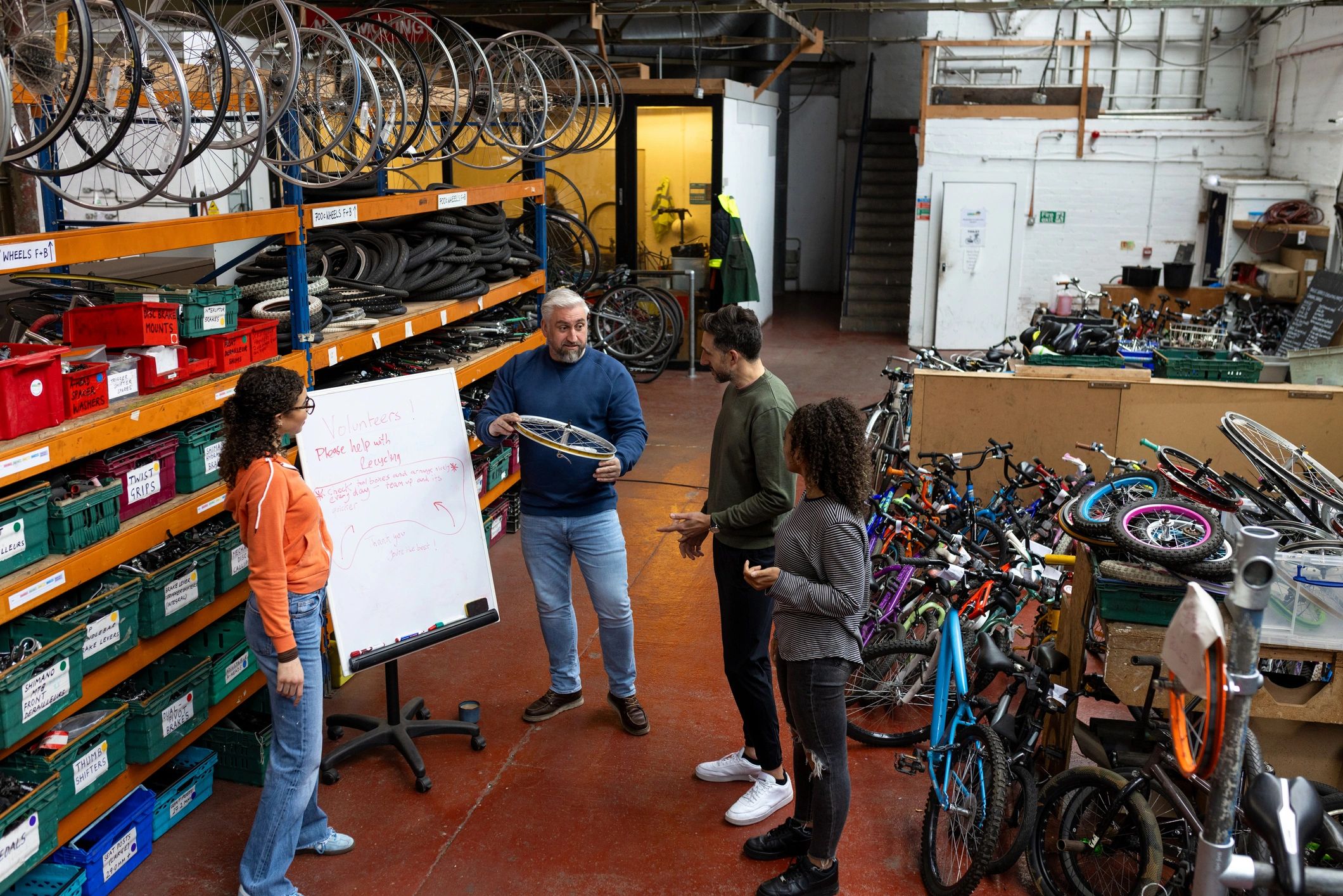 Local business members gathered around a whiteboard in discussion