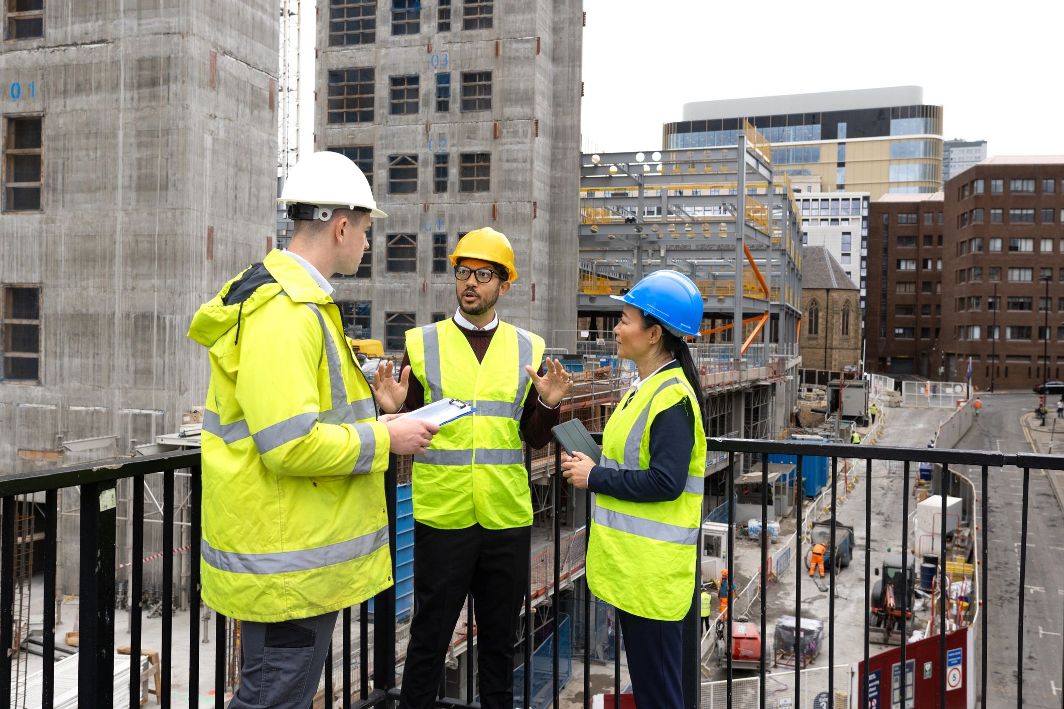 Trade professionals reviewing plans together